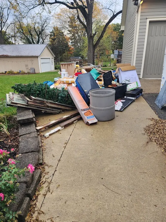 Dumpster being loaded with debris for Commercial Dumpster Rental in Roselle